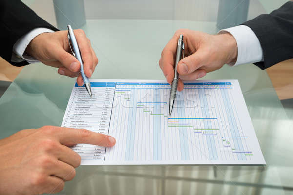 Two Businessmen Making Gantt Diagram Stock photo © AndreyPopov