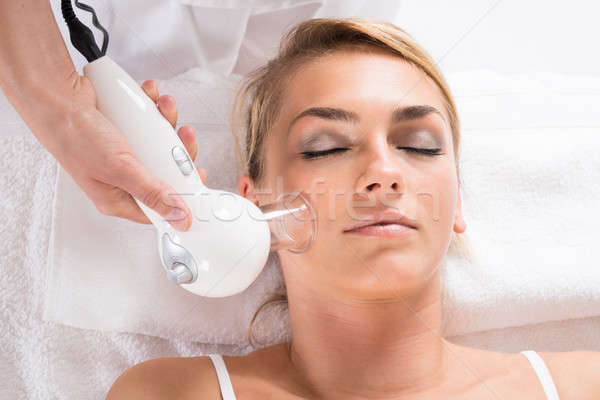 Woman Receiving Cellulite Vacuum Therapy On Face Stock photo © AndreyPopov