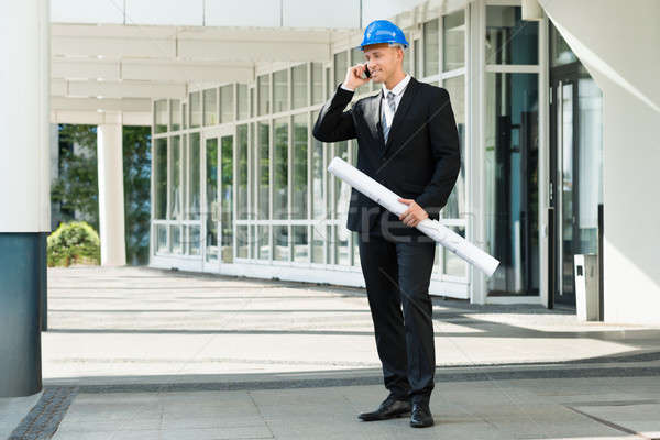Engineer With Blue Print Talking On Cellphone Stock photo © AndreyPopov