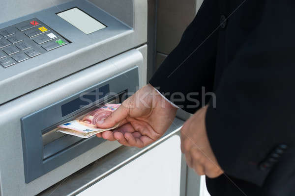 Person Withdrawing Money From Atm Machine Stock photo © AndreyPopov