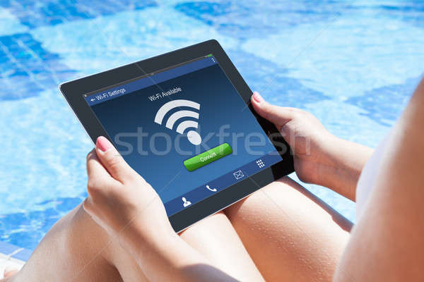 Woman With Digital Tablet At Pool Stock photo © AndreyPopov
