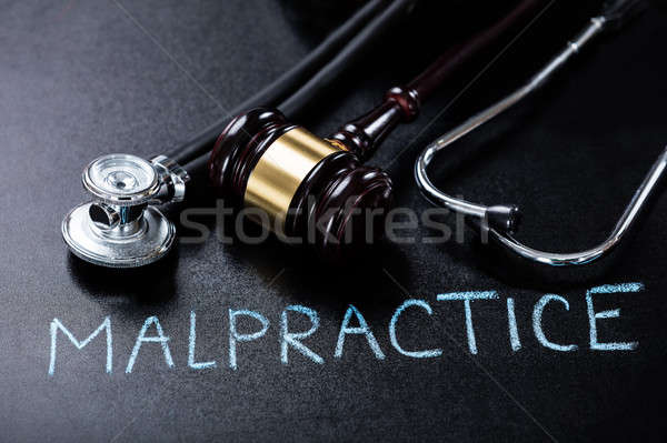 Malpractice Concept On Blackboard Stock photo © AndreyPopov