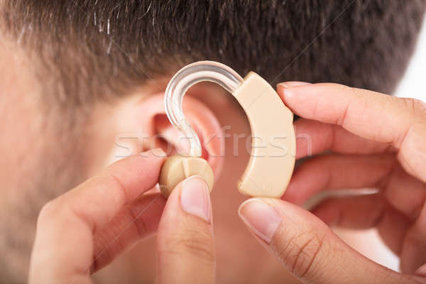 Stock photo: Person With A Hearing Aid