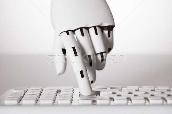 Robotic Hand Pressing Enter Key Stock photo © AndreyPopov