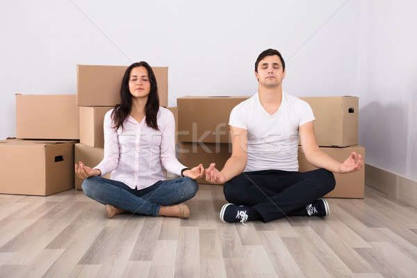 Young Couple Meditating Together Stock photo © AndreyPopov