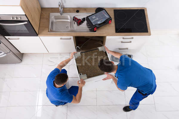 Kettő mosogatógép konyha fiatal férfi egyenruha Stock fotó © AndreyPopov