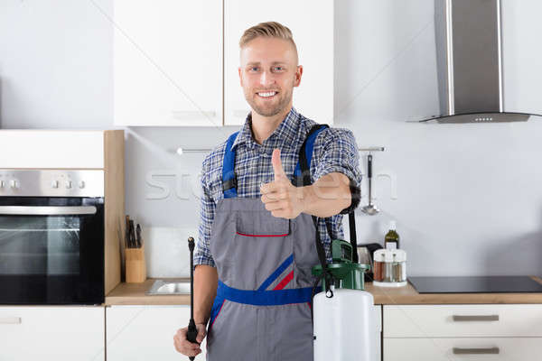 Confident Pest Control Worker With Pesticide Container Stock photo © AndreyPopov