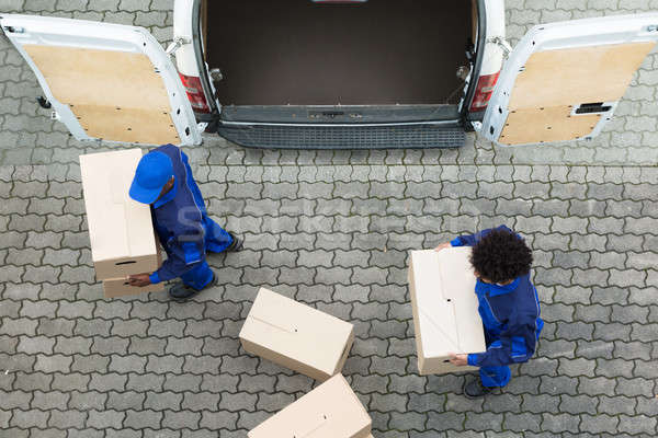 Delivery Men Unloading The Cardboard Boxes Stock photo © AndreyPopov