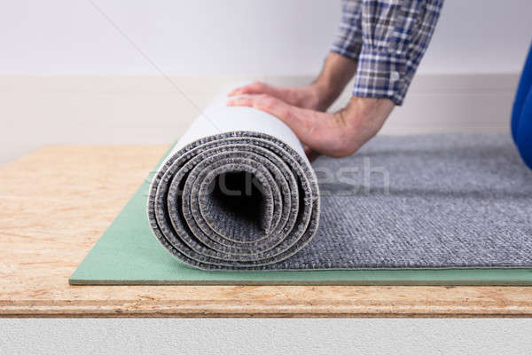 Close-up Of A Worker Installing Carpet Stock photo © AndreyPopov