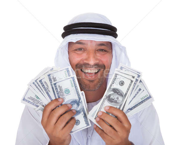 Portrait Of Mature Arab Man Holding Dollars Stock photo © AndreyPopov