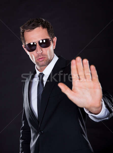 Portret jonge man stoppen gebaar geïsoleerd Stockfoto © AndreyPopov