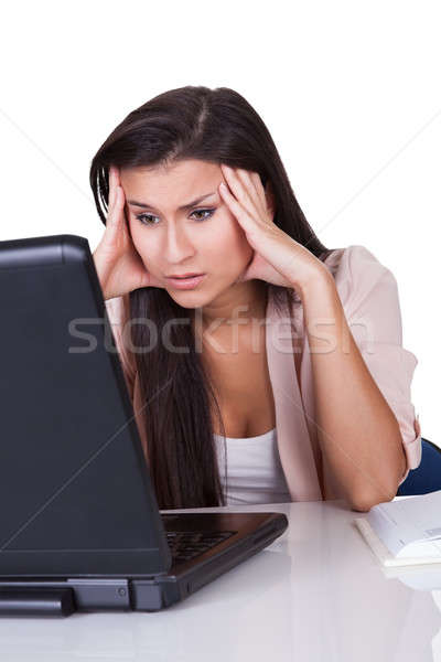 Unmotivated woman staring at her laptop Stock photo © AndreyPopov