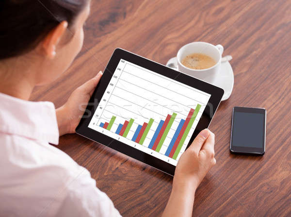 Stock photo: Woman With Digital  Tablet And Mobile Phone