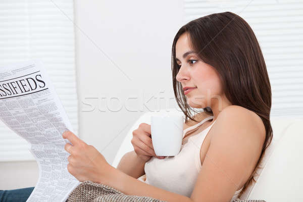Woman Reading Newspaper At Home Stock photo © AndreyPopov