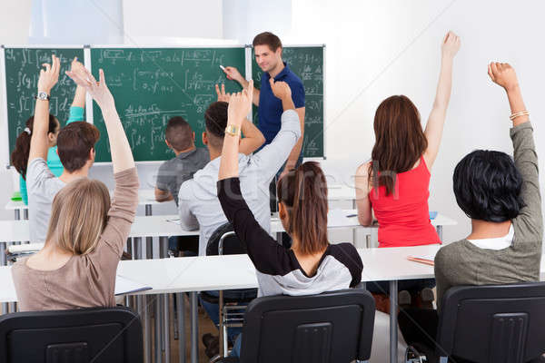 Diákok tanár matematika osztály egyetem karok a magasban Stock fotó © AndreyPopov