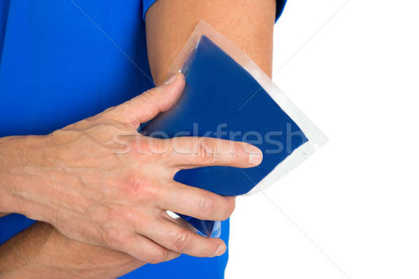Hand Holding Ice Gel Pack On Elbow Stock photo © AndreyPopov