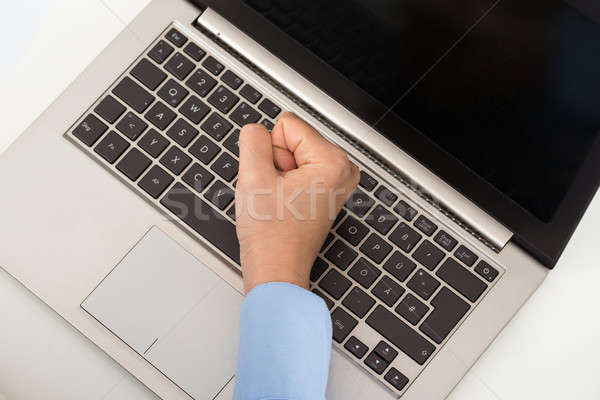 Businessperson Hand Fist On The Keyboard Stock photo © AndreyPopov
