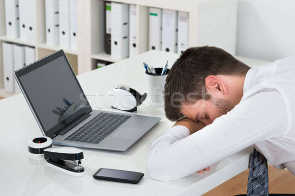 Businessman With Laptop Sleeping At Desk Stock Photo C Andriy