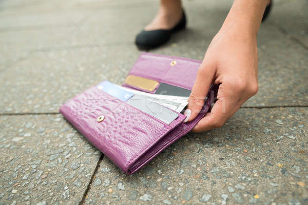 Woman Picking Up Fallen Wallet Stock photo © AndreyPopov
