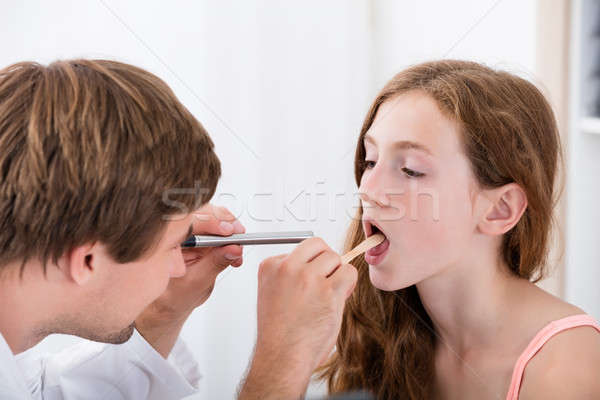 Close-up Of Doctor Examining Girl's Throat Stock photo © AndreyPopov