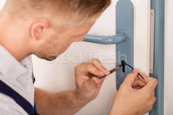 Man Opening Door Lock Stock photo © AndreyPopov