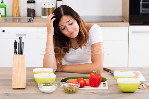 Unhappy Woman In Kitchen Stock photo © AndreyPopov