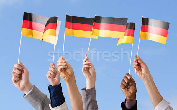 Hands Holding German Flag Stock photo © AndreyPopov