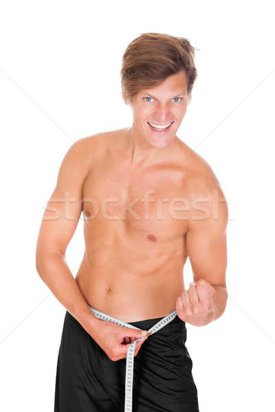 Man Measuring His Waistline Stock photo © AndreyPopov
