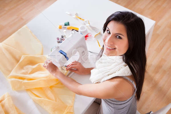女子 工作的 縫紉機 微笑 年輕女子 長 商業照片 © AndreyPopov