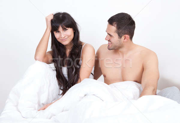 Stock photo: Couple waking up in bed