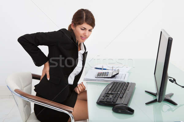 Kobieta interesu cierpienie ból w krzyżu komputera biurko zmęczony Zdjęcia stock © AndreyPopov