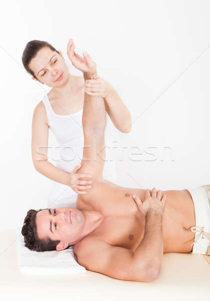 Woman Massaging Man's Hand Stock photo © AndreyPopov