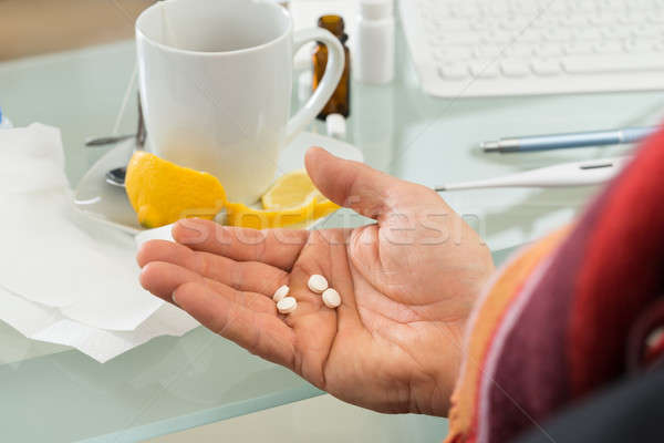 Stock photo: Businessman Holding Pills