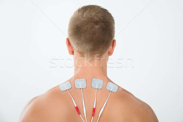 Man With Electrodes On Neck Stock photo © AndreyPopov