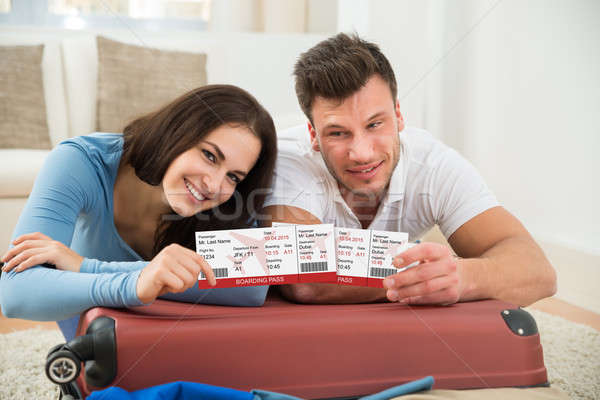 Happy Young Couple Showing Boarding Pass Stock photo © AndreyPopov