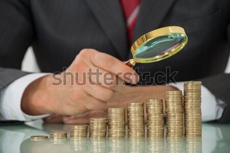 Corrupt Judge Hitting Gavel With Banknotes Spread At Desk Stock photo © AndreyPopov