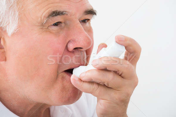 Uomo asma primo piano medicina bocca persona Foto d'archivio © AndreyPopov