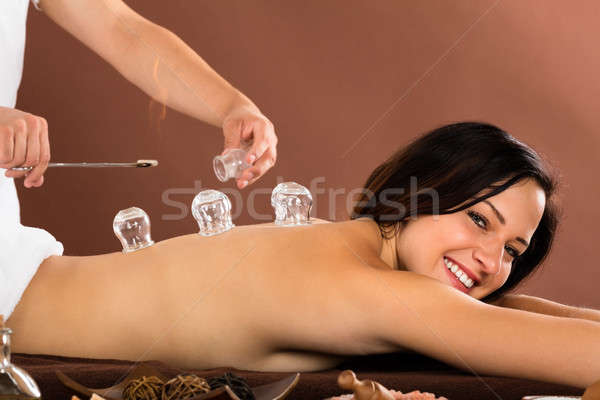 Woman Receiving Cupping Treatment On Back Stock photo © AndreyPopov