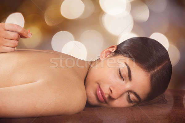 Woman Receiving Acupuncture Treatment In Spa Stock photo © AndreyPopov