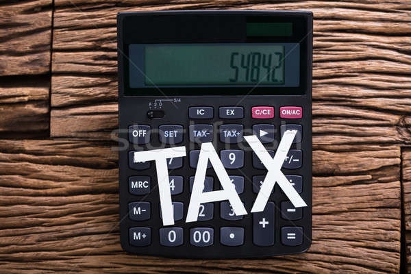 White Tax Word On Calculator Stock photo © AndreyPopov