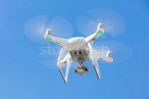 Stock photo: Drone flying against clear blue sky