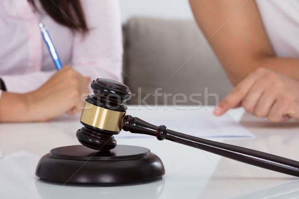 Couple Having Discussion Over Document In Courtroom Stock photo © AndreyPopov