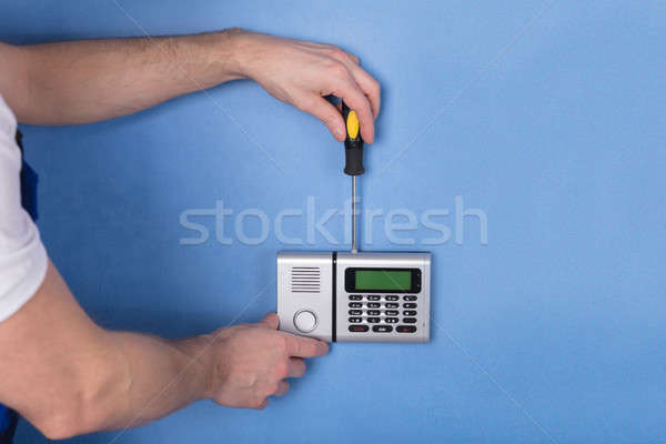 Human Hand Installing Security System Stock photo © AndreyPopov