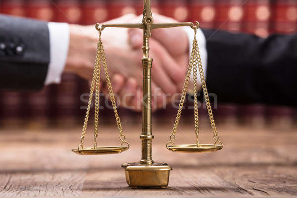 Close-up Of Justice Scale On Wooden Desk Stock photo © AndreyPopov