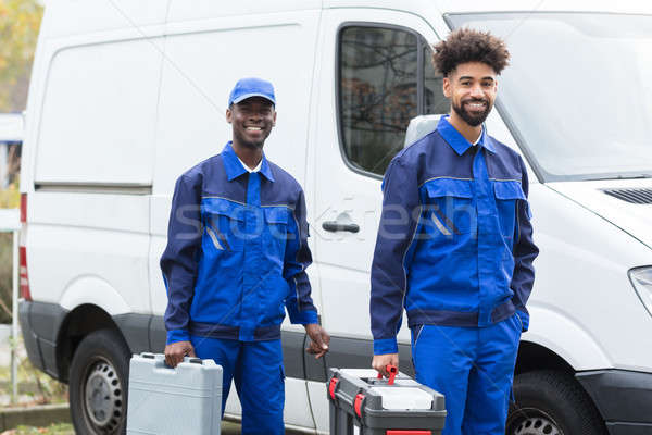 Portrait Of Two Young Manual Worker With Their Tool Boxes Stock photo © AndreyPopov