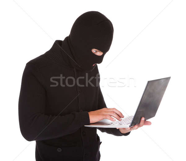 Einbrecher mit Laptop Porträt isoliert weiß Computer Stock foto © AndreyPopov