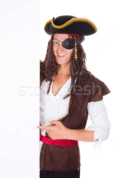 Young Pirate Pointing At Blank Placard Stock photo © AndreyPopov