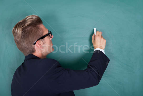 Jeunes Homme professeur enseignement portrait écrit [[stock_photo]] © AndreyPopov