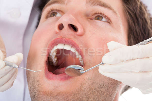 Dentist Examining Patient Stock photo © AndreyPopov