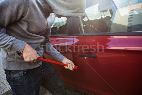 Thief Opening Car's Door With Crowbar Stock photo © AndreyPopov